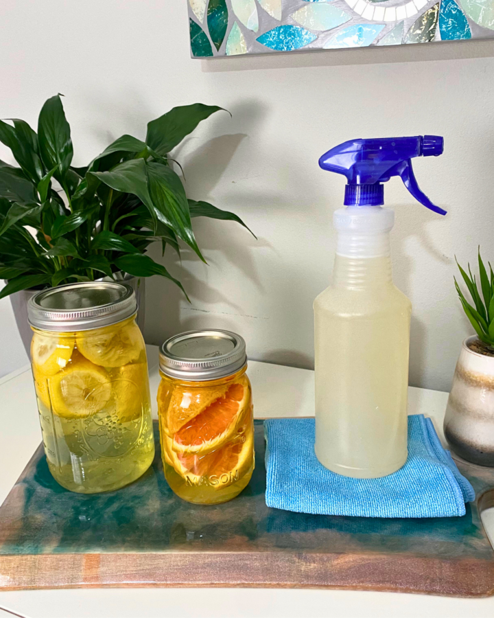 Citrus-scented vinegar with spray bottle solution and cleaning rag