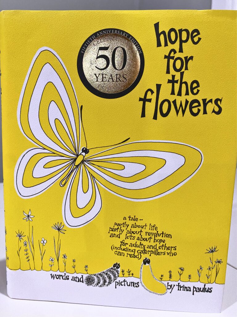 Hope for the Flowers book by Trina Paulas. Bright yellow cover with yellow and white butterfly, flowers, and two caterpillars looking up to sky