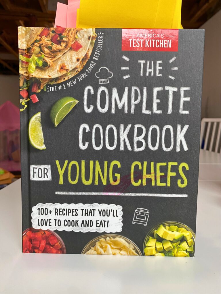 America's Test Kitchen: The Complete Cookbook for Young Chefs standing upright on a white table