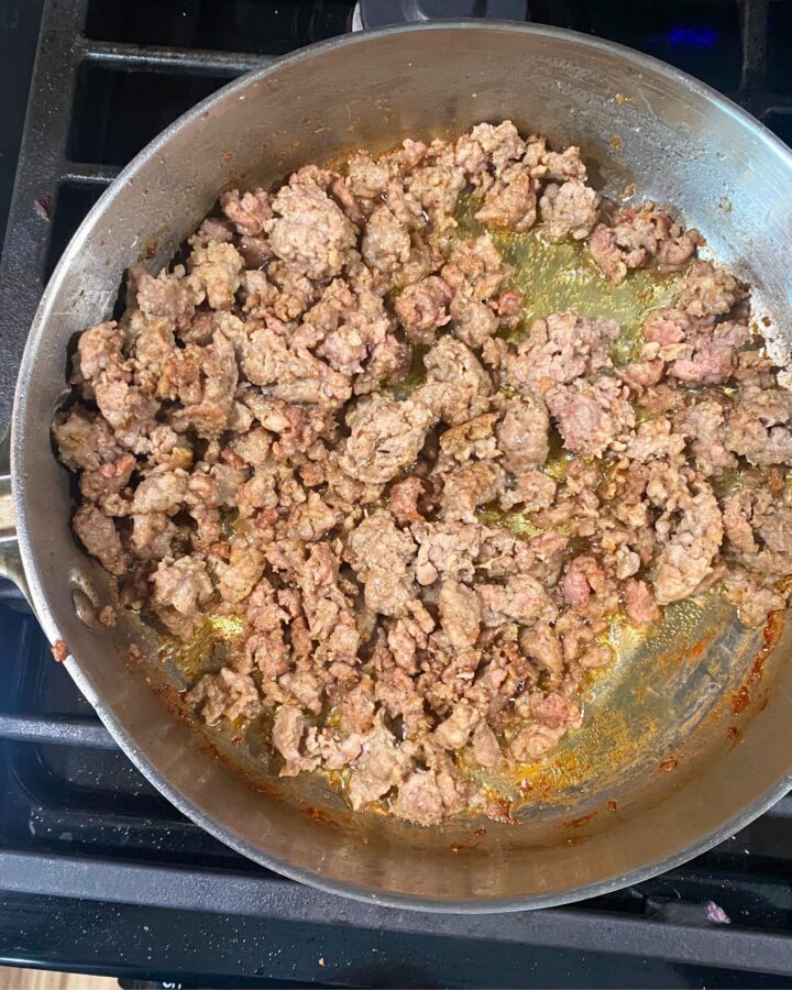 browned sausage for gravy recipe in skillet on stovetop