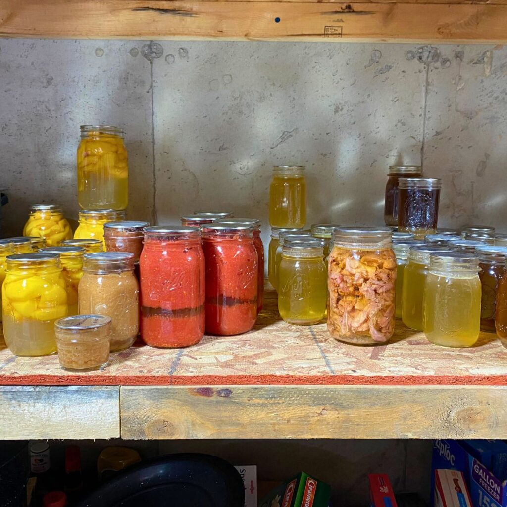 pantry stockpile of home-canned goods on a shelf