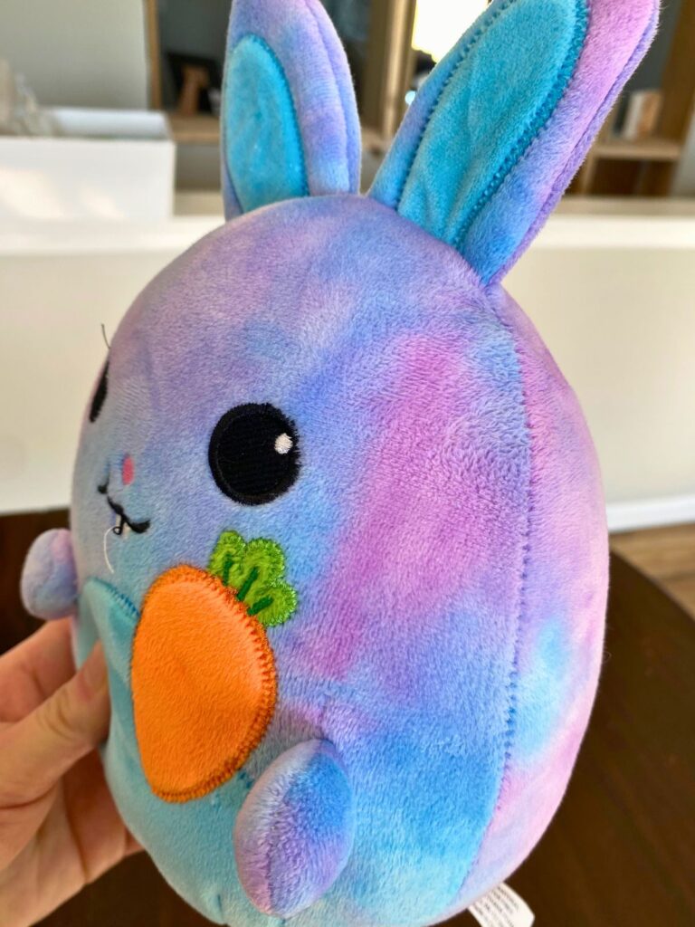 A baby's stuffed bunny after it was cleaned with a baking soda and vinegar paste. The stains on the ear and side of the head are completely gone.